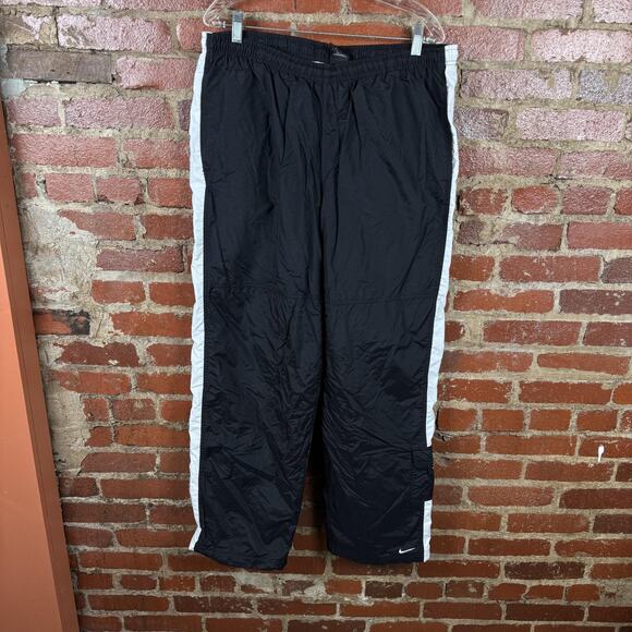 Nike Track Pants Mens XL Black White Side Stripe Lined Warm Up Athletic Swoosh - Picture 1 of 6